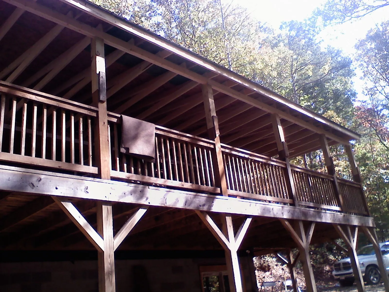 Timber framing under a new elevated porch and deck — Roof Leak Repair in Cambria Heights by Roofing Brothers